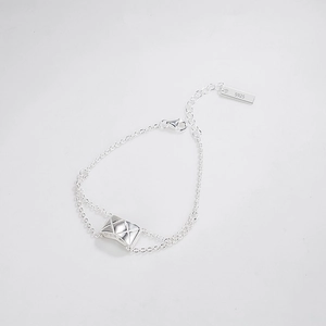 Minimalist S925 silver bracelet featuring a diamond-quilted envelope pendant and extension chain