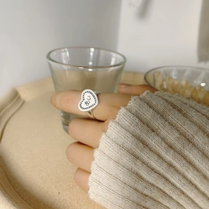Elegant S925 sterling silver heart ring with Ai character engraving on female model hand