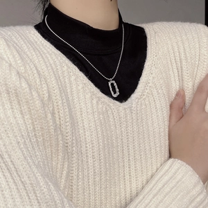 Detail of S925 sterling silver rectangular hollow pendant with textured finish on neck