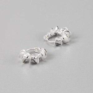 Pair of 925 sterling silver hoop earrings with twisted spiral design on grey background