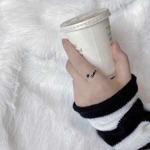 Close-up of adjustable 925 silver ring featuring FAITH engraving and cross pattern