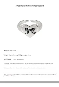 Detailed view of S925 sterling silver heart ring with a black bow engraving
