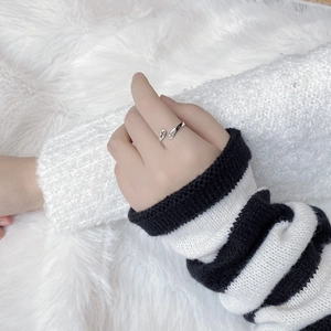 Artistic S925 sterling silver ring with abstract face carving worn on model
