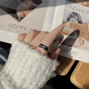 Detail view of S925 silver heartbeat ring with black enamel and open adjustable band