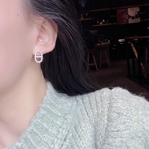 Macro detail of S925 sterling silver pig nose stud earrings with bead texture design
