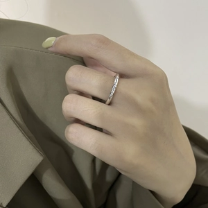 Minimalist S925 sterling silver smile ring with cursive engraving worn on hand