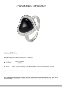 Detail of vintage S925 sterling silver ring featuring a black onyx heart and beaded edges
