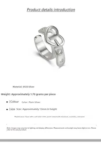 Macro detail of S925 sterling silver heart buckle ring featuring adjustable band and weight