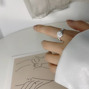 Macro detail of S925 silver chain ring featuring I Love You engraving and heart motifs