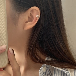 Minimalist S925 sterling silver triple-layer ear cuff worn on the ear bone cartilage