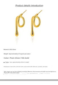 Macro detail of minimalist S925 silver spiral earrings with 18k gold plating 29mm