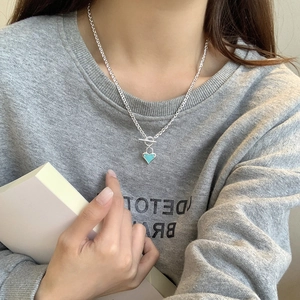 925 silver heart enamel necklace with toggle clasp and light blue pendant on model