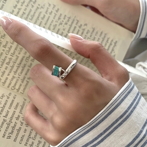 S925 sterling silver open ring with blue enamel lock pendant on hands with book
