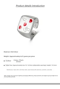 Macro detail of S925 sterling silver ring with red enamel hearts and engraved letters