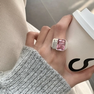 Detailed macro view of 925 silver ring featuring a large pink zircon and side engraving