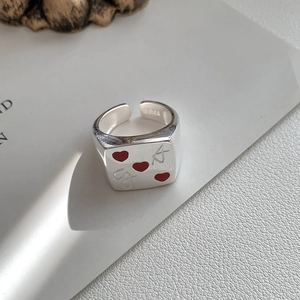 Detail of S925 sterling silver ring featuring red hearts and A-J letter engravings