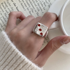 Minimalist 925 silver ring featuring red enamel hearts and abstract poker style engraving