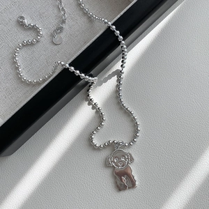Detailed view of S925 sterling silver teddy dog pendant with polished ball chain necklace