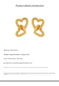 Macro shot of 7mm gold S925 silver double heart earrings with irregular hammered texture