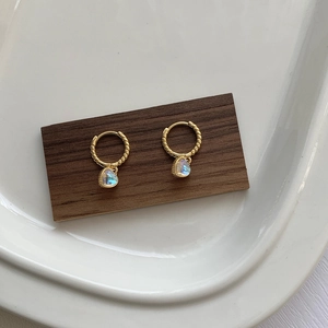 Elegant gold S925 silver twist hoop earrings with iridescent moonstone heart pendants