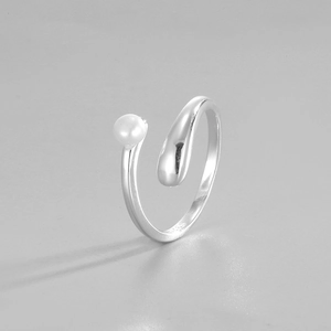 Macro detail of S925 sterling silver stamp on the open ring with freshwater pearl