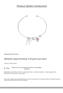 Detail of S925 sterling silver bangle with pink heart, bow and star charms
