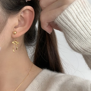 S925 silver heart and ribbon bow stud earrings with a dangling elegant gold finish
