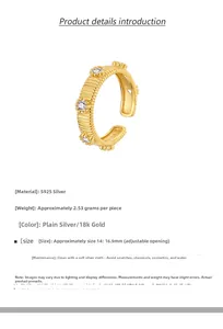 Detail of S925 silver adjustable ring in 18K gold with vertical texture and zircons