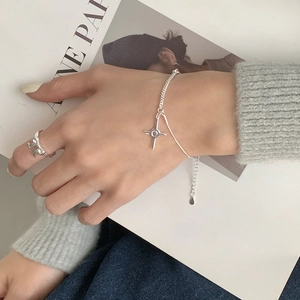 S925 sterling silver cross charm bracelet and bow ring set worn by model
