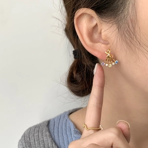 Elegant gold butterfly fan earrings with multi-colored zircon stones on female model