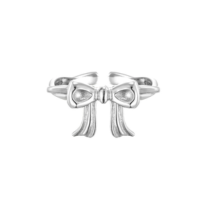 Adjustable S925 sterling silver bow ring with textured finish on a white background