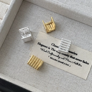 Detailed view of S925 sterling silver geometric square hoop earrings in gold and silver