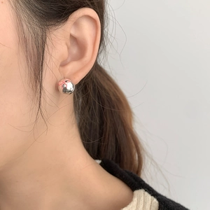 Model wearing S925 silver stud earrings with a pink enamel butterfly pattern design