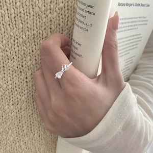Elegant S925 silver bow ring with pear-cut crystals on a delicate adjustable band