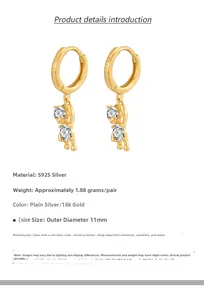 Detailed close-up of S925 sterling silver bear hoop earrings with gold plating and zircons