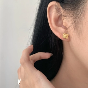 Elegant gold square stud earrings with heart embossing and textured finish for women