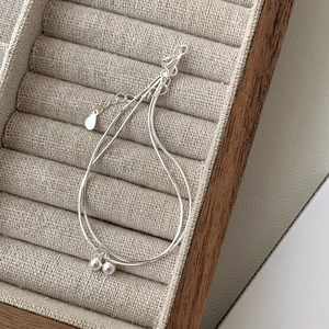Minimalist S925 sterling silver double layer bead bracelet displayed on jewelry tray