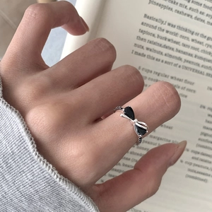 Elegant S925 silver bow ring featuring black teardrop stones and pavé accents for women