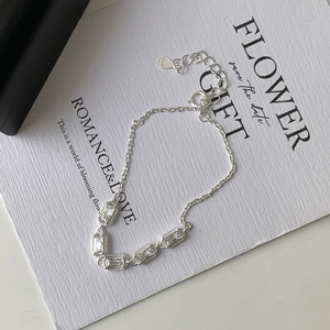 Detailed macro view of S925 sterling silver bracelet with five rectangular zircons