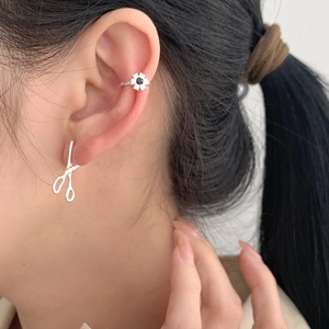 Close-up of S925 silver scissors earrings and floral ear cuff with black diamond inlay
