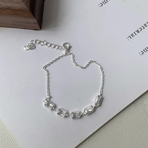 Close-up of S925 sterling silver bracelet featuring five rectangular zircon stones