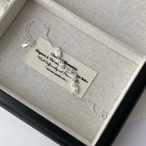 Detail view of S925 sterling silver bracelet featuring five rectangular cubic zirconia stones
