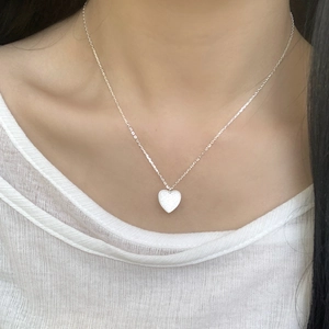 Sparkling S925 sterling silver heart necklace with pavé diamonds on a delicate chain