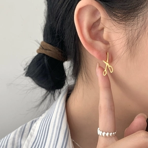 Unique 925 sterling silver scissors shaped gold stud earrings for women on model