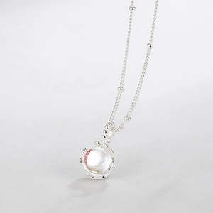 French style S925 silver necklace with moonstone pendant on minimalist background