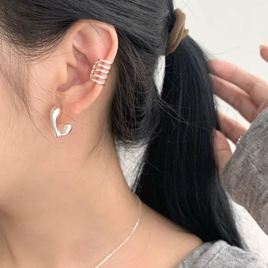 S925 sterling silver geometric ear cuff and heart earring set on model's ear