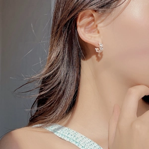 Elegant S925 sterling silver oval hoop earrings with sparkling cubic zirconia on model