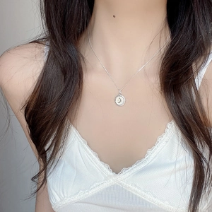 S925 sterling silver moon necklace featuring a round white agate shell pendant on model