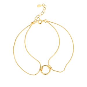 Double-layered gold snake chain bracelet with minimalist circle charm and polished finish