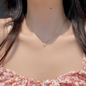 925 sterling silver flower necklace with pink crystal on a dainty beaded gold chain